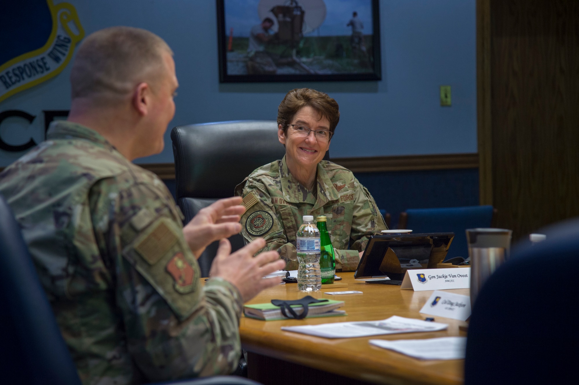 Gen. Jacqueline Van Ovost, Air Mobility Command commander, receives a mission brief on the 621st Contingency Response Wing by Col. Douglas Jackson, 621st CRW commander, Dec. 11, 2020, at Joint Base McGuire-Dix-Lakehurst, New Jersey. During the visit, Van Ovost and Chief Master Sgt. Brian Kruzelnick, AMC command chief, experienced firsthand how the 621st CRW supports AMC’s priorities of developing the force, advancing warfighting capabilities, projecting the joint force and ensuring strategic deterrence. (U.S. Air Force photo by Staff Sgt. Sarah Brice)