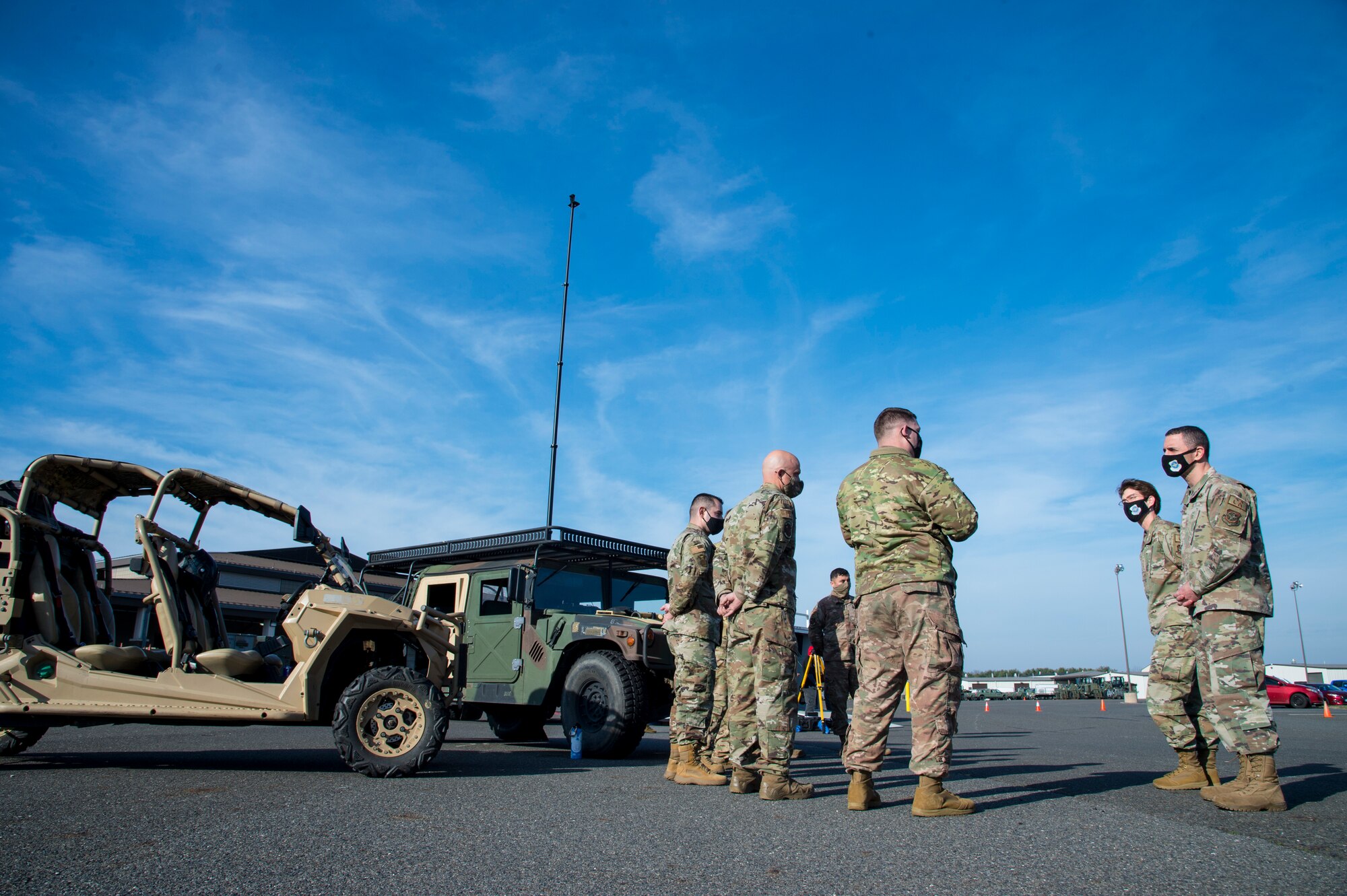 Gen. Jacqueline Van Ovost, Air Mobility Command commander, and Chief Master Sgt. Brian Kruzelnick, AMC command chief, receive a brief from Airmen who recently participated in an Agile Combat Employment exercise Dec. 11, 2020, at Joint Base McGuire-Dix-Lakehurst, New Jersey. During their visit, Van Ovost and Kruzelnick met with various units to get a closer look at the mission sets the multi-capable Airmen of the 621st Contingency Response Wing execute to deliver Rapid Global Mobility for the nation. (U.S. Air Force photo by Staff Sgt. Sarah Brice)