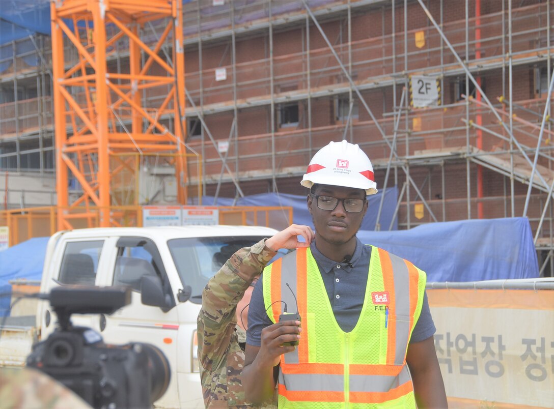 AMIE Intern Oluwaferanmi Olulana pauses for an interview with Armed Forces Network (AFN) about his FED internship.