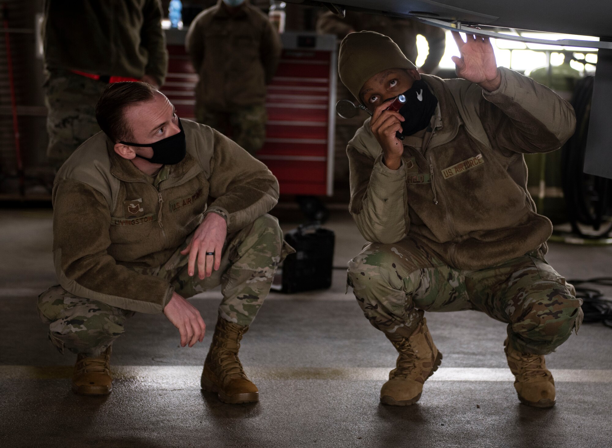 U.S. Air Force Staff Sgt. Joseph Livingston, 52nd Maintenance Group maintenance training instructor, left, and Tech Sgt. Jeremy Mayfield, 52nd Maintenance Squadron engine technician, conduct a pre-flight inspection on an F-16 Fighting Falcon, Dec. 9, 2020, at Spangdahlem Air Base, Germany. The Agile Combat Employment course allows Airmen to become certified in other career field capabilities, giving them the opportunity to become multifunctional and versatile whenever necessary. (U.S. Air Force photo by Senior Airman Melody W. Howley)