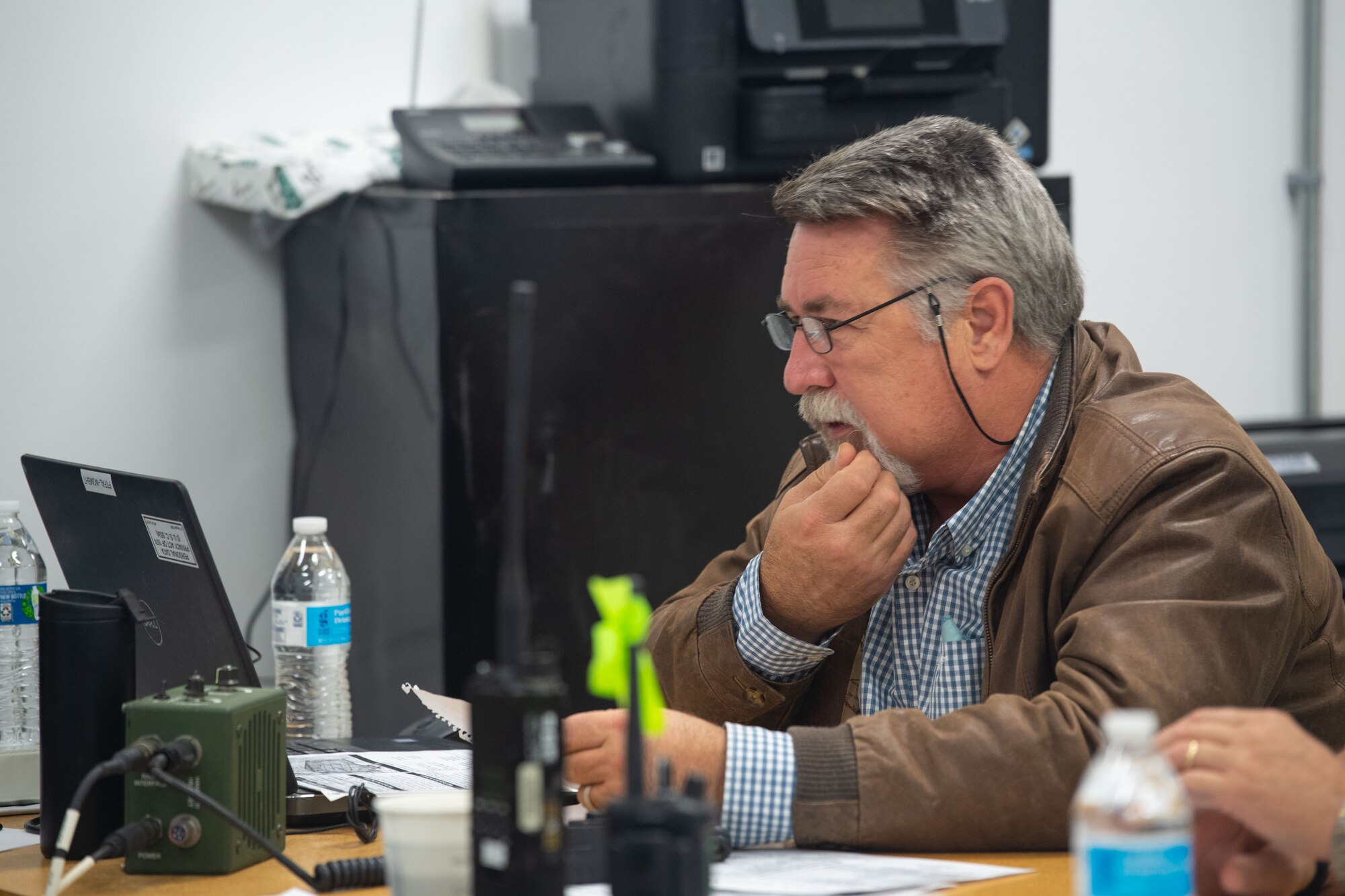 A control-room operator observes a test prior to an XQ-58A Valkyrie launch at the U.S. Army Yuma Proving Ground, Ariz., Dec. 7, 2020. More than 50 team members came together to make the historic flight a safe event. The joint effort included a Marine Corps F-35B variant, an Air Force F-22 Raptor, and an Air Force F-35A variant. The Air Force F-22 and F-35A aircraft flew with the attritableONE platform for the first time.