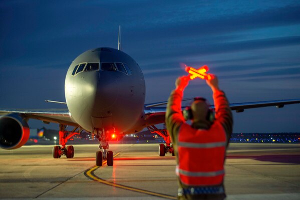 Air Force Staff Sgt. Joshua Poticha, a New Hampshire Air National Guardsman, marshals a KC-46A tanker at Pease Air National Guard Base, N. H., Dec. 11, 2020.