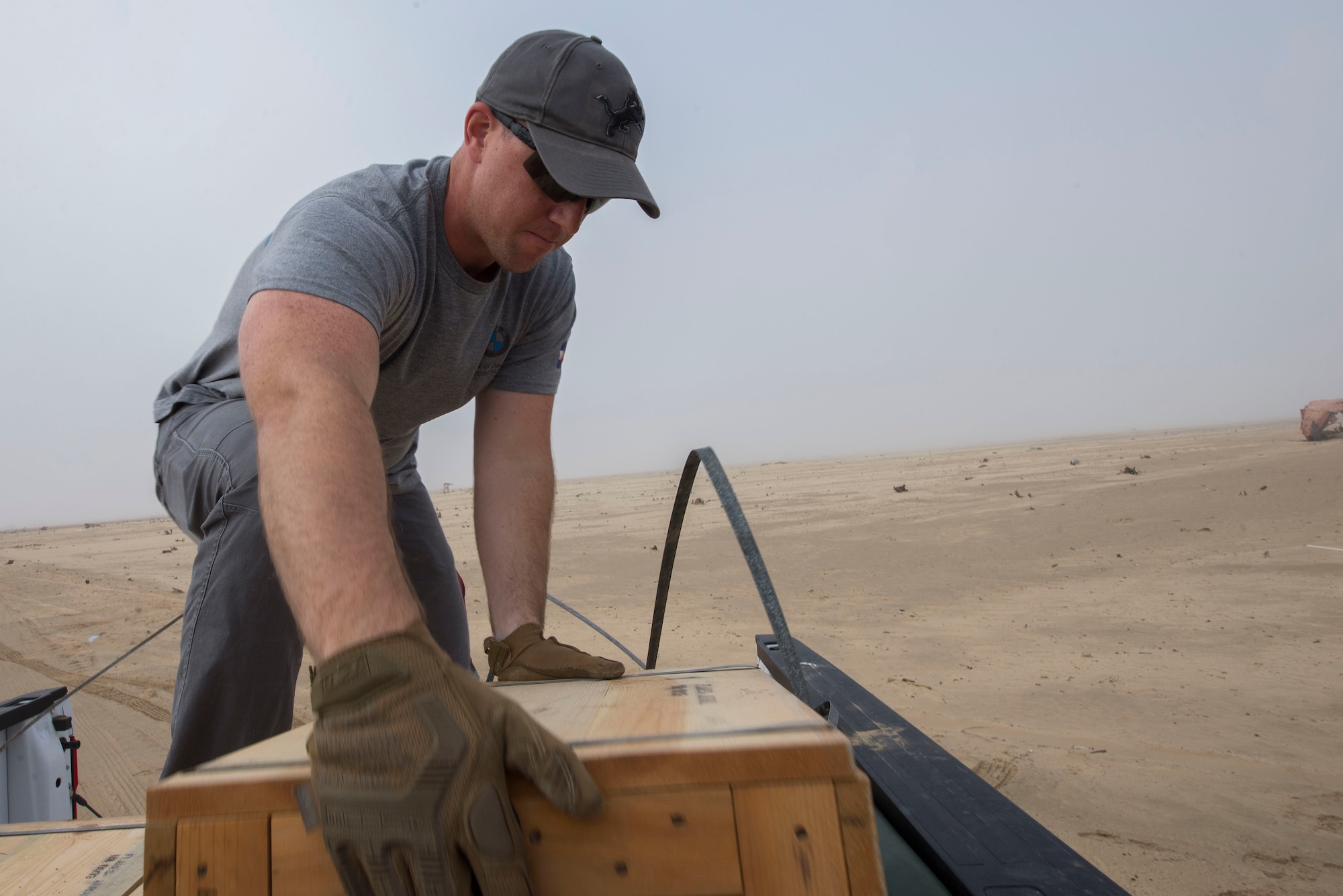 U.S. Air Force Tech. Sgt. Kyle Koski, 380th Expeditionary Civil Engineer Squadron (ECES) Explosive Ordnance Disposal (EOD) logistics section chief, unloads unserviceable munitions to be safely disposed of near Al Dhafra Air Base, United Arab Emirates, Dec. 5, 2020.