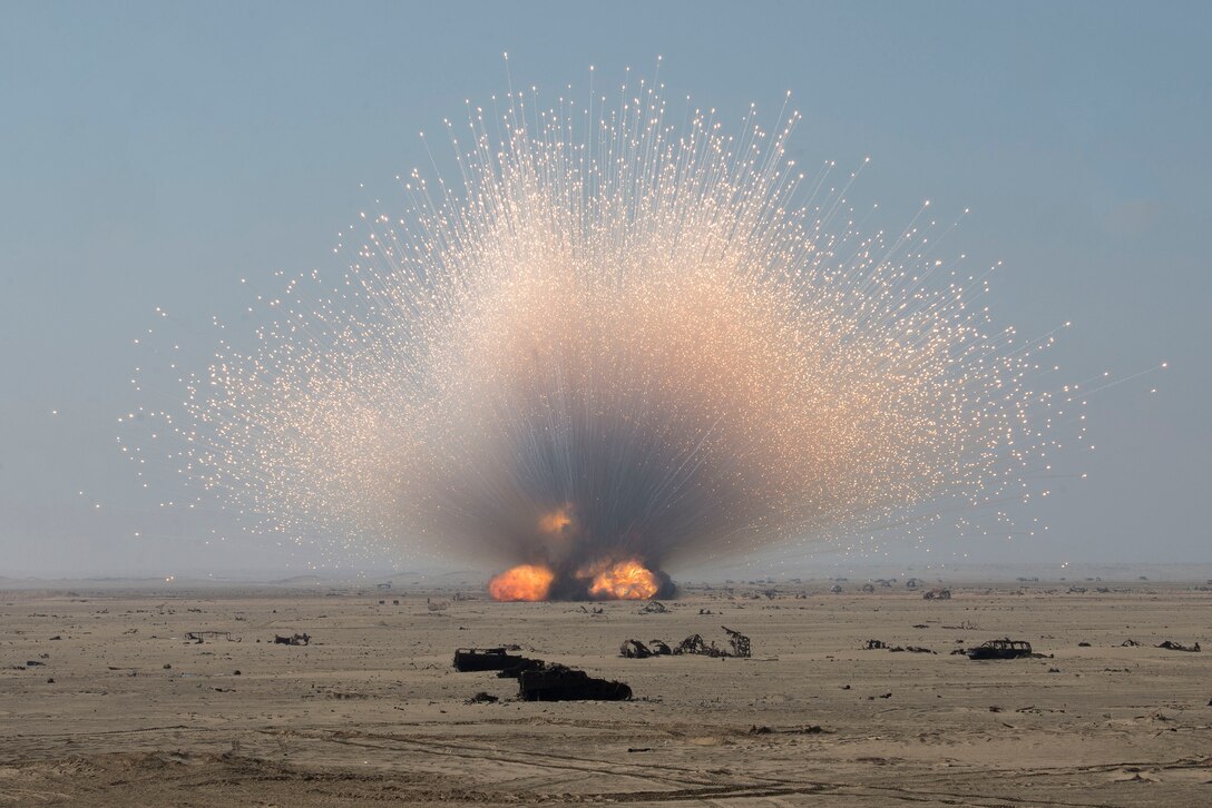 Airmen assigned to the 380th Expeditionary Civil Engineer Squadron (ECES) Explosive Ordnance Disposal (EOD) flight safely dispose of unserviceable munitions as part of an ammunitions disposition request (ADR) operation near Al Dhafra Air Base, United Arab Emirates, Dec. 5, 2020.