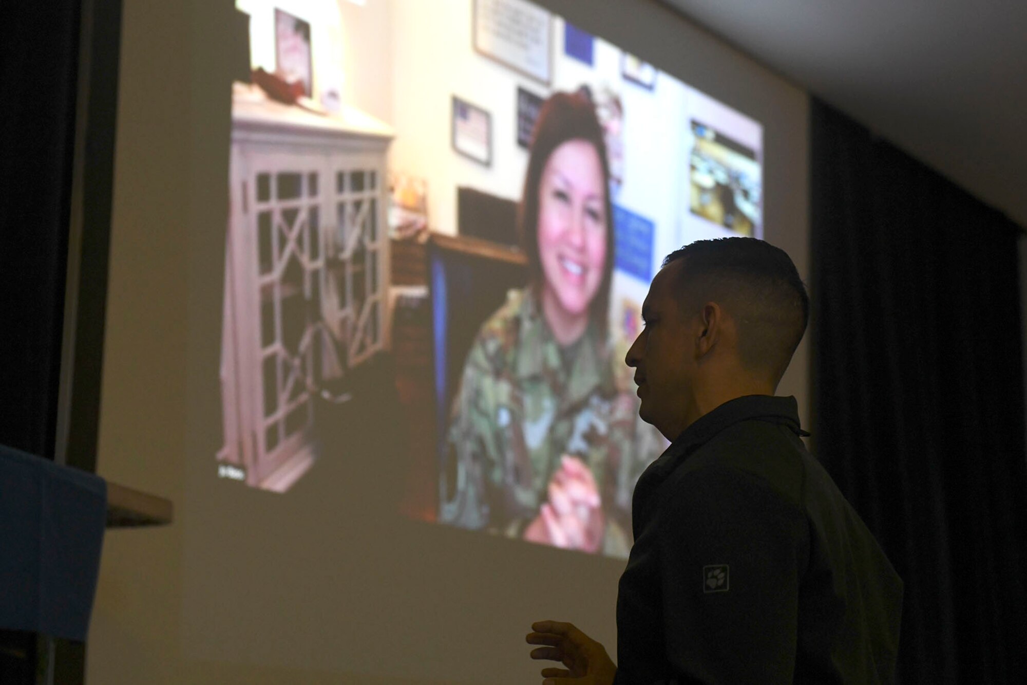 Chief Master Sgt. Cesar Flores, 100th Operations Group superintendent, asks Chief Master Sgt. of the Air Force JoAnne S. Bass about the future of physical fitness evaluations during a leadership workshop at Royal Air Force Mildenhall, England, Dec. 11, 2020. During the talk, Bass took the opportunity to highlight her priorities of People, Readiness and Culture while emphasizing staying connected with Airmen during this challenging, yet critical, time. (U.S. Air Force photo by Staff Sgt. Mackenzie Mendez)