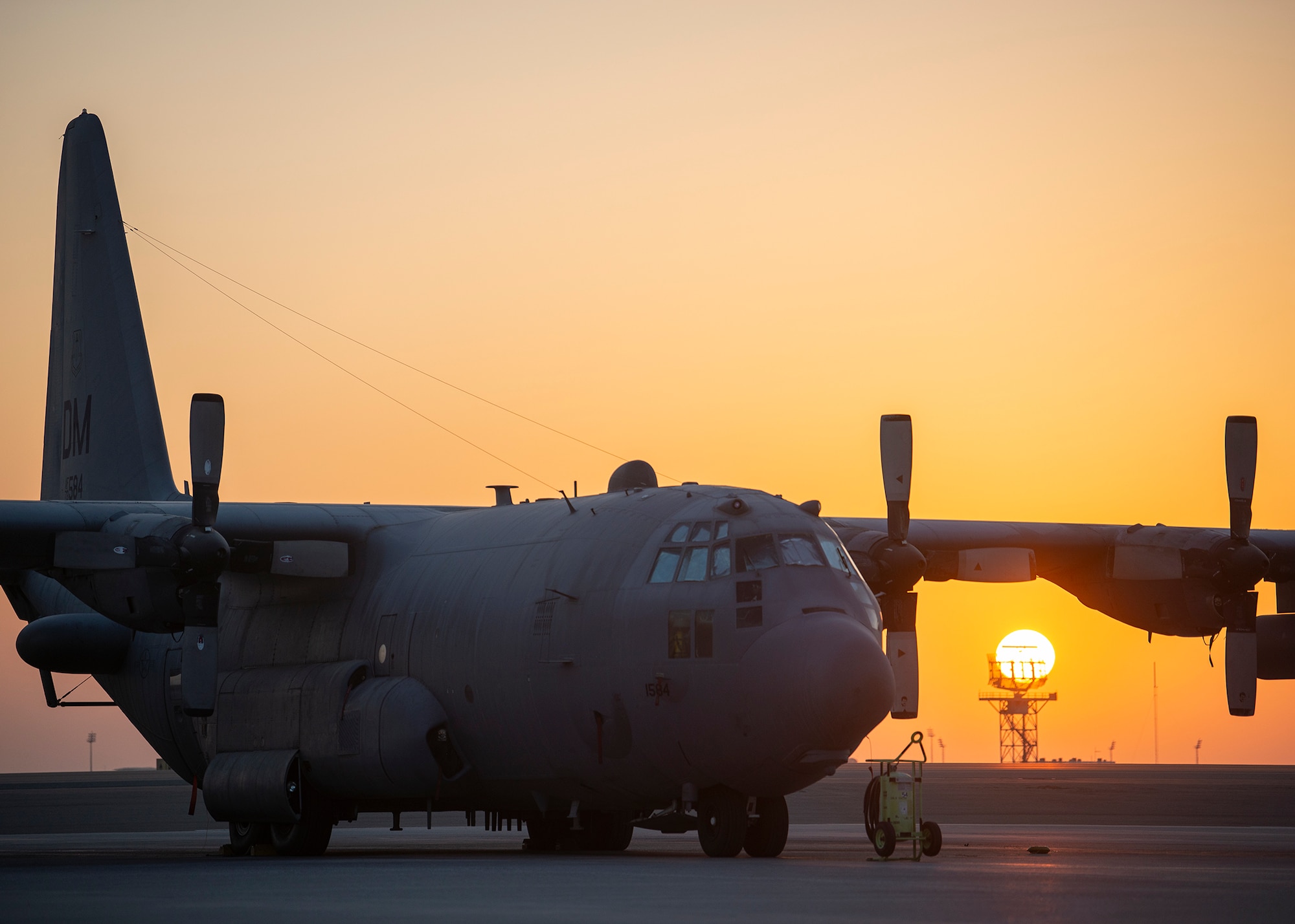 A U.S. Air Force EC-130H Compass Call assigned to 41st Expeditionary Electronic Combat Squadron sits parked on the ramp at Al Dhafra Air Base, United Arab Emirates, Dec. 2, 2020.