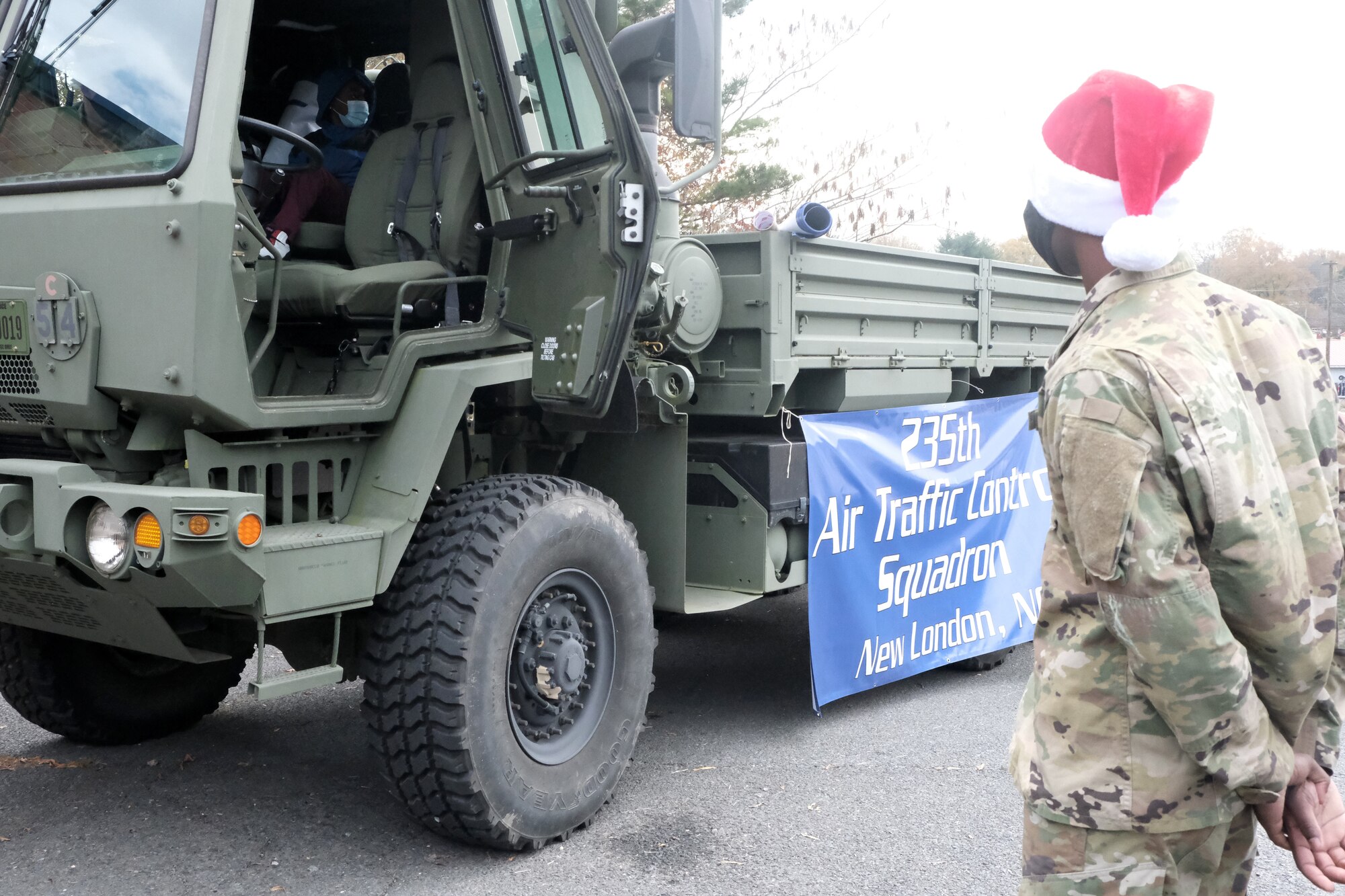 A five-ton truck, M10-35, used by the 235th Air Traffic Control Squadron for hauling beacons onto a flight line, is set-up for Operation Santa Claus held at Oakboro Elementary School in Oakboro, N.C. Dec. 13, 2020. The Chapter 7 organization within the North Carolina Air National Guard hosts the Annual Operation Santa Claus event as a way to reach out to the community and spread holiday cheer and spirit. Chapter 7 and volunteers passed out nearly 100 boxes of food donated by the local Food Lion as well as 50 presents designated to students within the school.