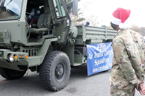 A five-ton truck, M10-35, used by the 235th Air Traffic Control Squadron for hauling beacons onto a flight line, is set-up for Operation Santa Claus held at Oakboro Elementary School in Oakboro, N.C. Dec. 13, 2020. The Chapter 7 organization within the North Carolina Air National Guard hosts the Annual Operation Santa Claus event as a way to reach out to the community and spread holiday cheer and spirit. Chapter 7 and volunteers passed out nearly 100 boxes of food donated by the local Food Lion as well as 50 presents designated to students within the school.