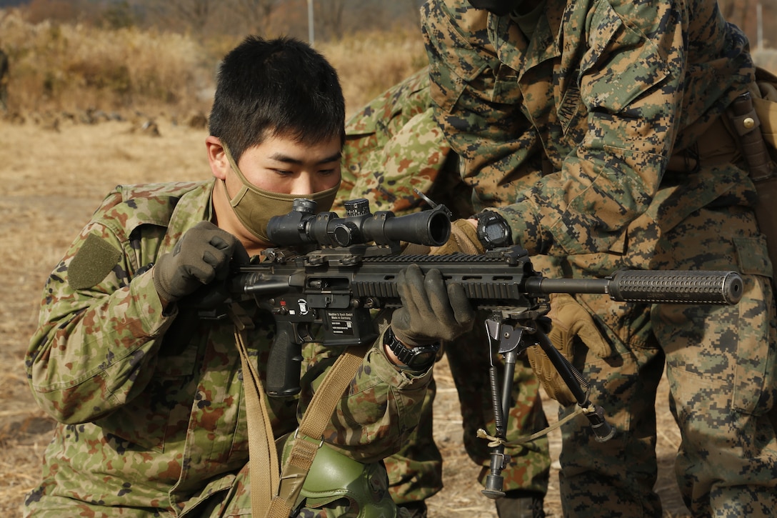 An infantryman from the Japan Ground Self-Defense Force function checks a M38 Designated Marksmanship Rifle during exercise Forest Light Eastern Army in mainland Japan, on Dec. 13.