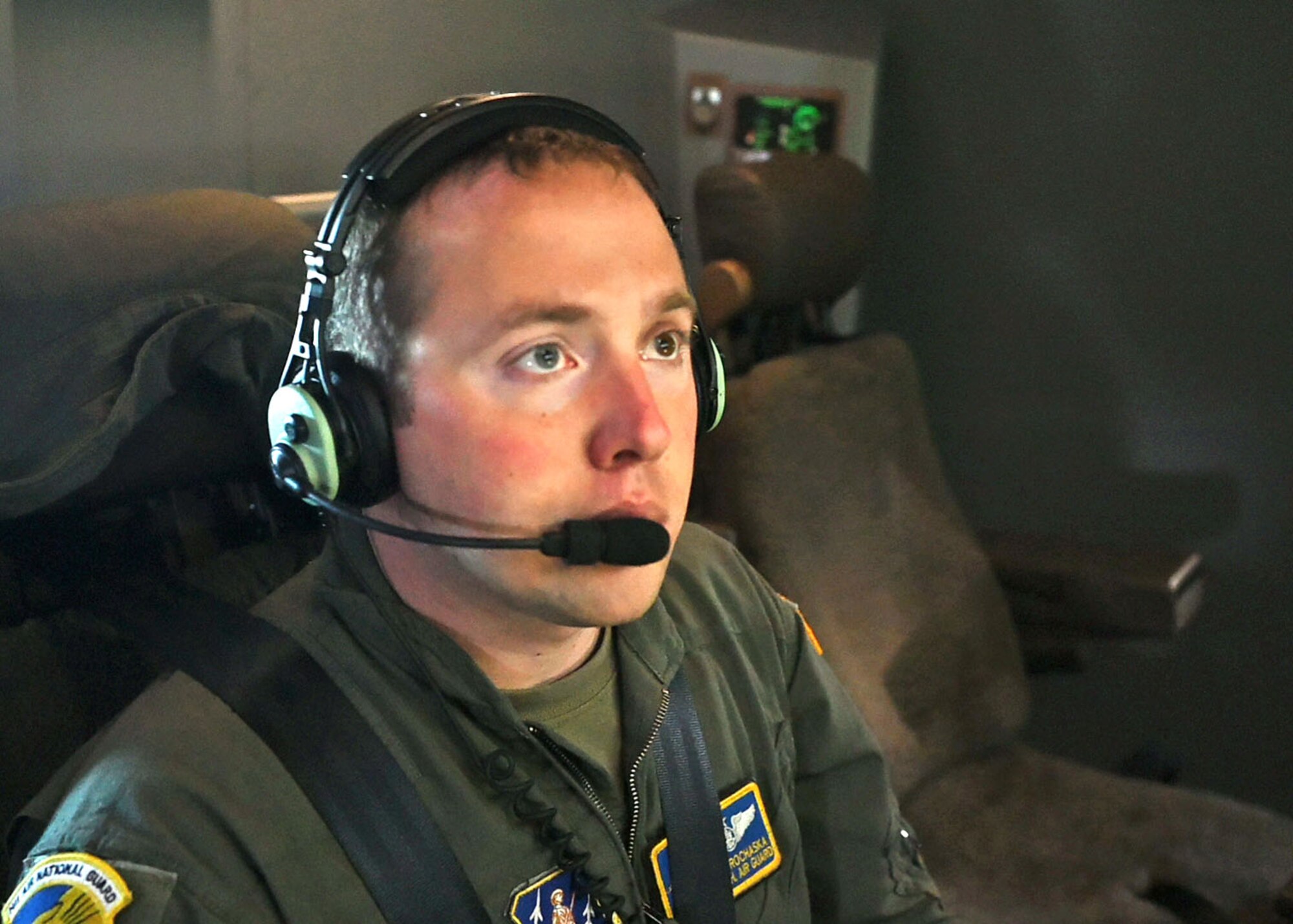 Tech. Sgt. Keith Prochaska, boom operator, 133rd Air Refueling Squadron, NHANG, works the controls of a refueling drogue aboard a KC-46A Pegasus during a refueling of Blue Angels F/A-18 Super Hornets.