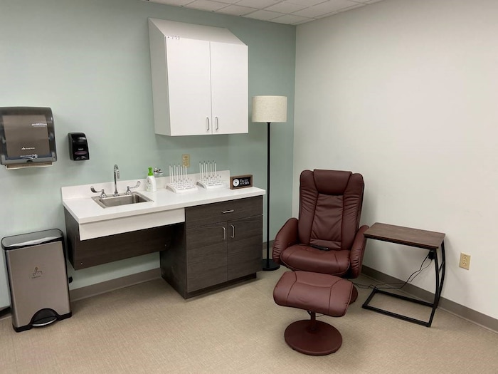 Photo shows room with a lounge chair set up.