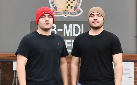 Two young men with winter caps