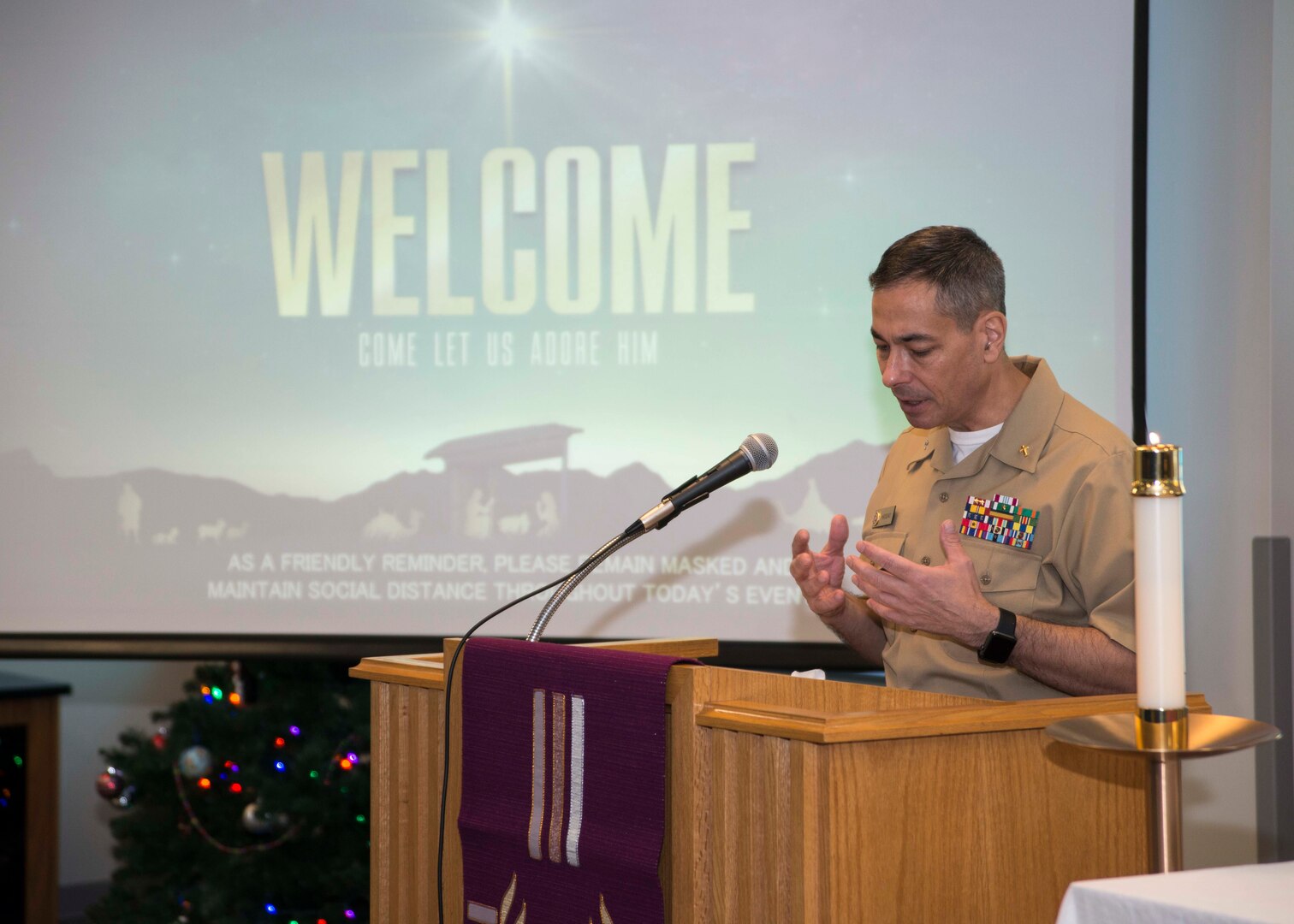 Capt. Wayne Haddad, reginal chaplain for Naval Medical Forces Atlantic (MEDLANT), speaks during Lessons and Carols in Naval Medical Center Portsmouth’s (NMCP) Chapel on Dec. 11.