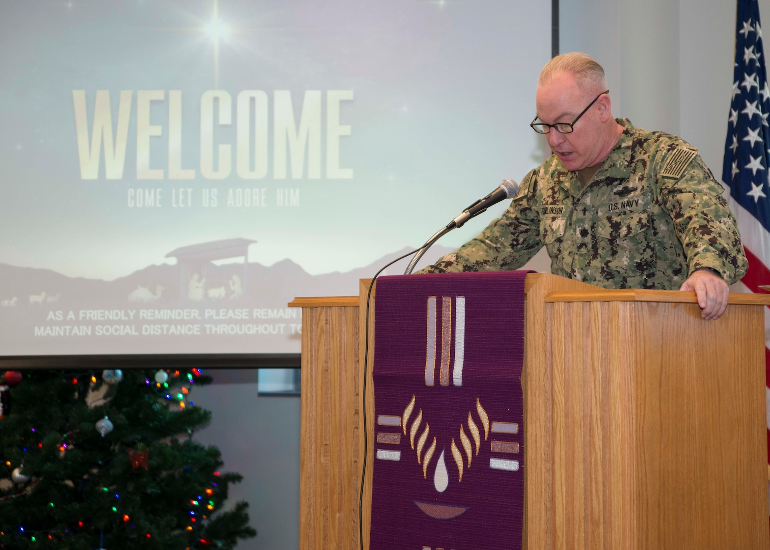 Cmdr. Michael Tomlinson, a staff chaplain at Naval Medical Center Portsmouth (NMCP), speaks during Lessons and Carols in Naval Medical Center Portsmouth’s (NMCP) Chapel on Dec. 11.