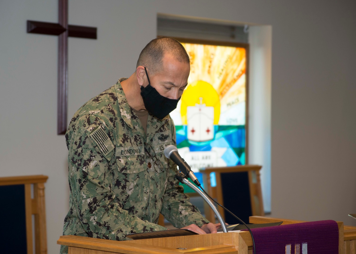 t. Cmdr. Diego Londono, a staff chaplain at Naval Medical Center Portsmouth (NMCP), speaks during Lessons and Carols in Naval Medical Center Portsmouth’s (NMCP) Chapel on Dec. 11.