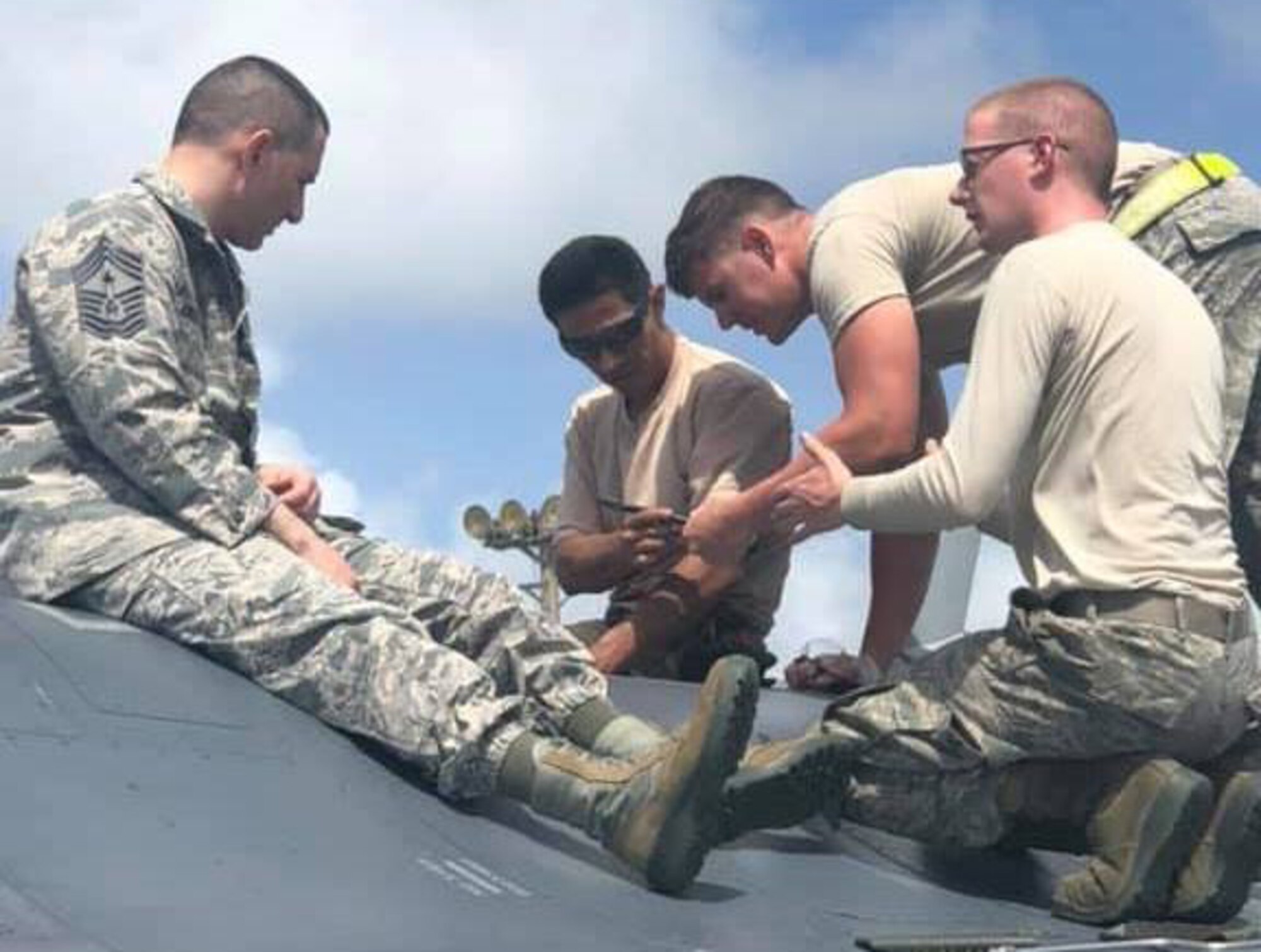 Chief Master Sgt. Brian Kruzelnick, command chief of Air Mobility Command, works alongside Airmen at Misawa Air Base, Japan, March 7, 2019. The Airmen showed Kruzelnick, then-Fifth Air Force command chief, an F-16 Fighting Falcon engine roll back during Exercise Cope North. (Courtesy photo)