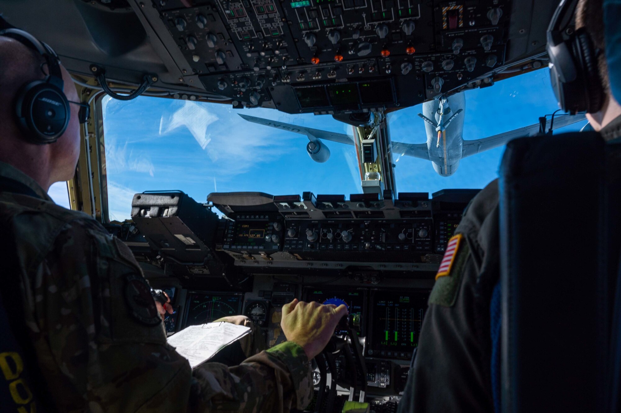 Maj. James Kovarovic, 3rd Airlift Squadron instructor pilot and 1st Lt. Jon Hobb, 3rd Airlift Squadron pilot, pre-position a C-17 Globemaster III for an in-flight refueling with a KC-135 Stratotanker assigned to the 134th Air Refueling Wing, Tennessee Air National Guard on Dec. 10, 2020. The 436th Airlift Wing routinely flies training missions to maintain mission readiness. (U.S. Air Force photo by Airman 1st Class Faith Schaefer)