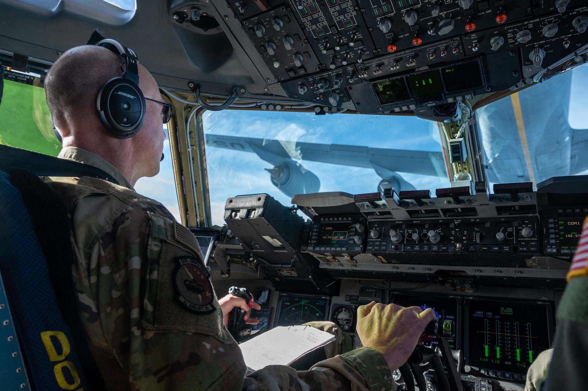 Maj. James Kovarovic, 3rd Airlift Squadron instructor pilot, positions a C-17 Globemaster III for an inflight refueling with a KC-135 Stratotanker assigned to the 134th Air Refueling Wing, Tennessee Air National Guard on Dec. 10, 2020. The 436th Airlift Wing operates routine training missions to maintain mission readiness. (U.S. Air Force photo by Airman 1st Class Faith Schaefer)