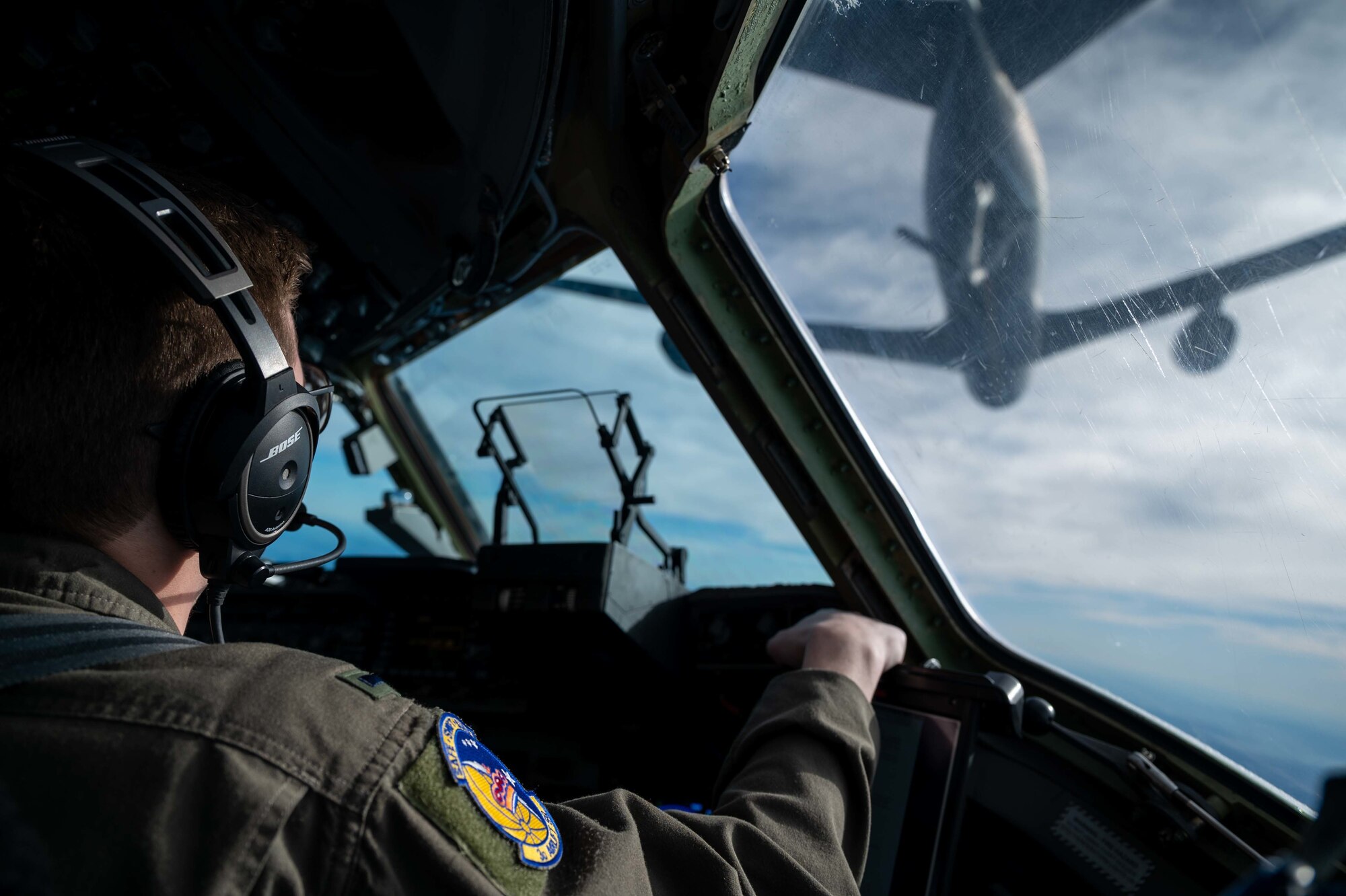 1st Lt. Jon Hobbs, 3rd Airlift Squadron pilot, prepares a C-17 Globemaster III for an in-flight refueling with a KC-135 Stratotanker assigned to the 134th Air Refueling Wing, Tennessee Air National Guard on Dec. 10, 2020. The 436th Airlift Wing operates routine training missions to maintain mission readiness. (U.S. Air Force photo by Airman 1st Class Faith Schaefer)