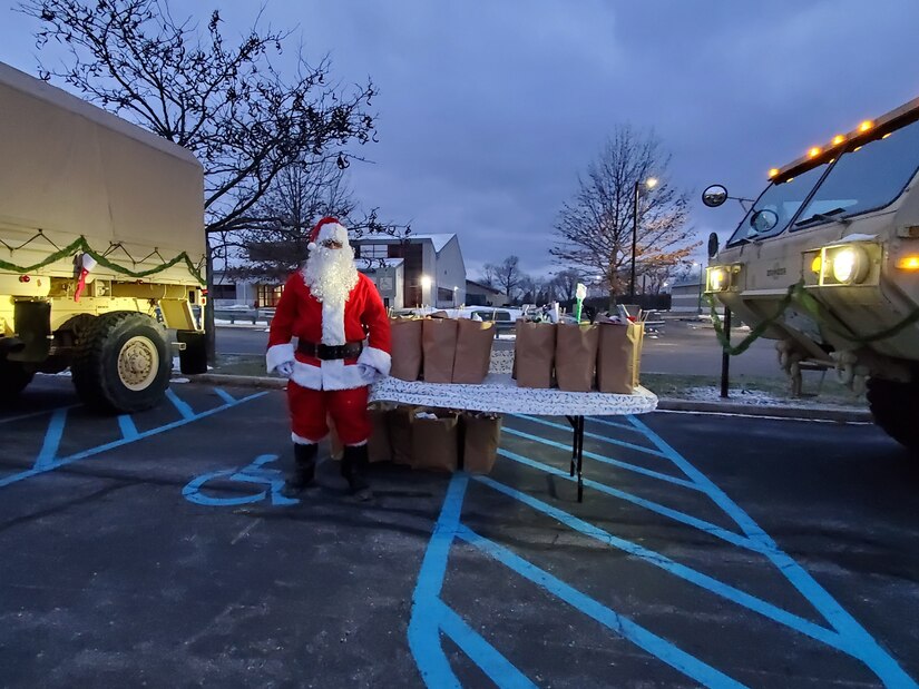 Santa Claus poses for a photo during Park & Presents, an event held Dec. 8-10 where children of deployed 28th ECAB Soldiers enjoyed a drive-thru style visit with Santa and received a bag of toys. (Courtesy Photo by Rebecca Leidy)