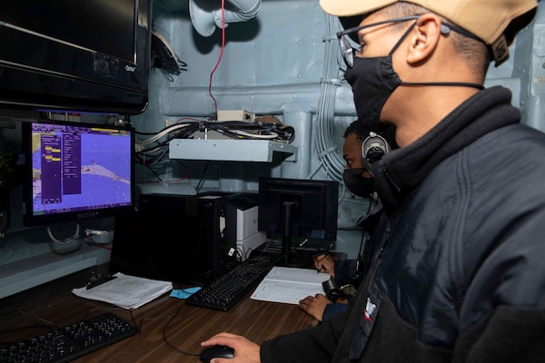 Quartermaster 3rd Class Isaiah Kiel, front, and Quartermaster 3rd Class Kahiem Walker test the navigation radar aboard the Wasp-class amphibious assault ship USS Kearsarge (LHD 3) Dec. 15, 2020.