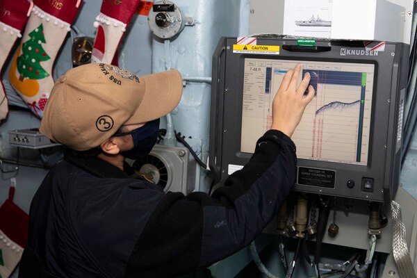 Electronics Technician 3rd Class Celina Sanchezgomez tests the fathometer aboard the Wasp-class amphibious assault ship USS Kearsarge (LHD 3) Dec. 15, 2020.