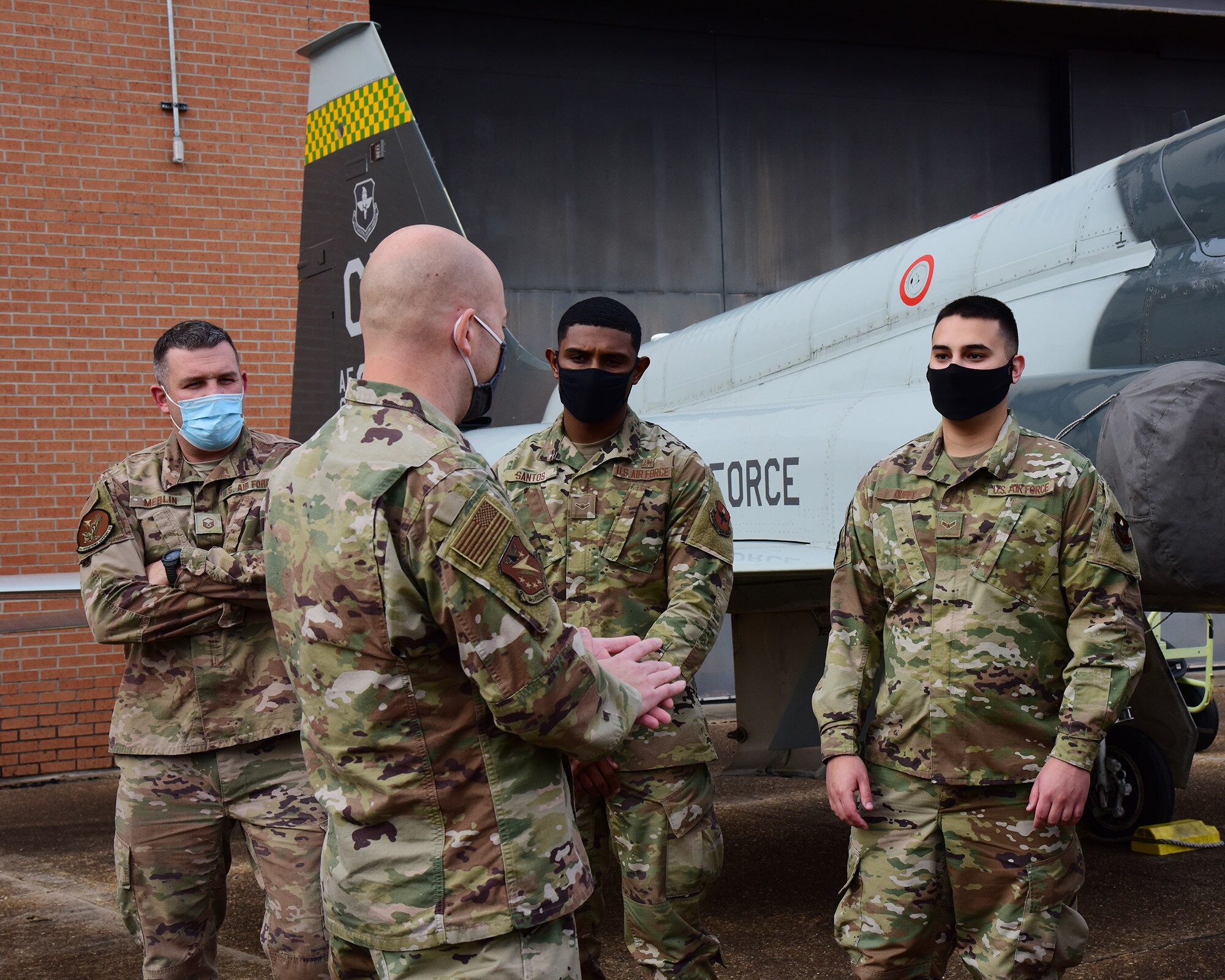 Chief Master Sgt. Trevor James, 14th Flying Training Wing command chief, talks with Airmen from the Columbus Air Force Base Honor Guard, Dec. 11, 2020, on Columbus Air Force Base, Miss. The Honor Guard also supports many community and base events such as change of commands, retirement ceremonies, community parades, and formal events. (U.S. Air Force photo by Melissa Duncan-Doublin)