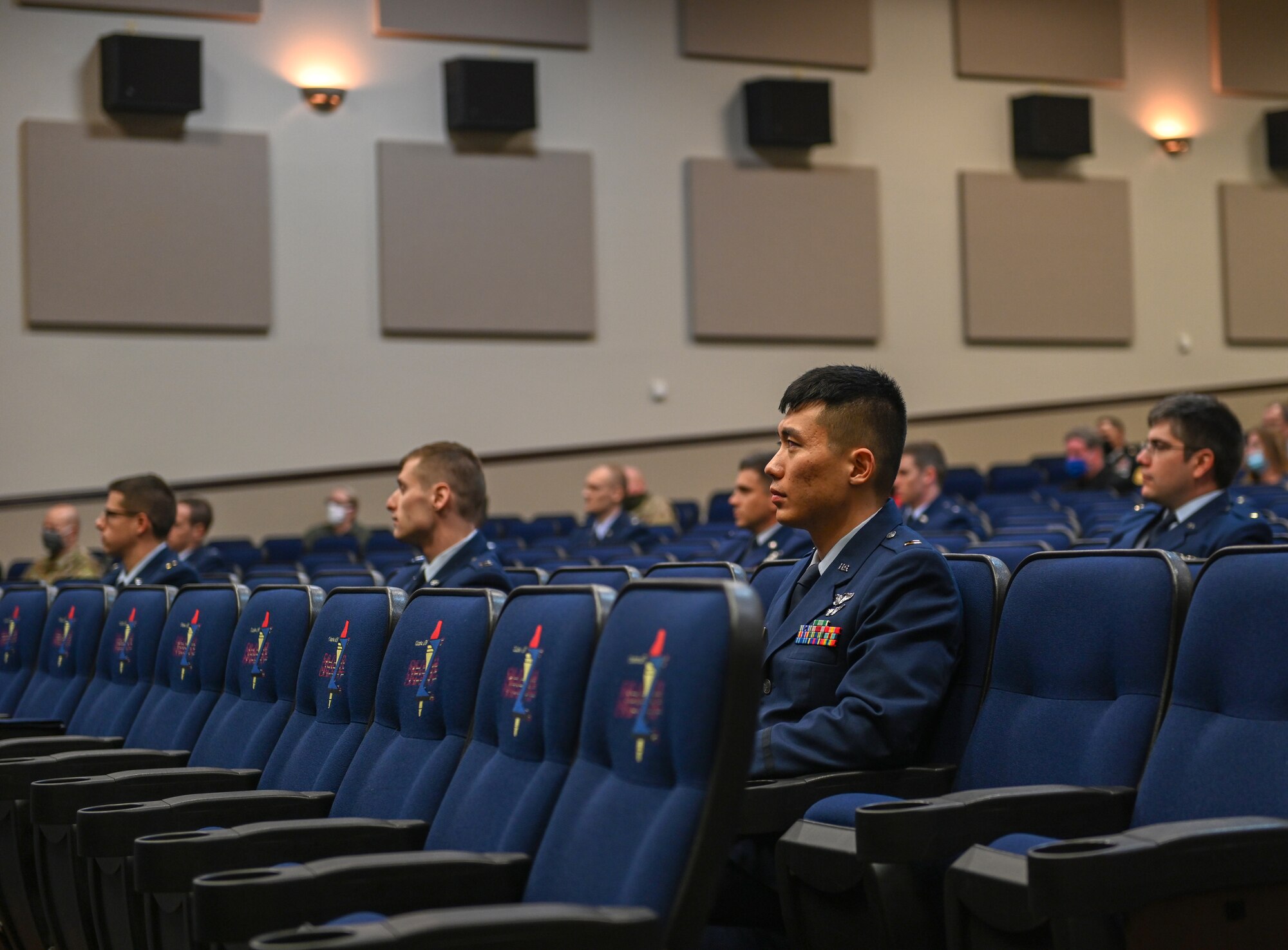 Specialized Undergraduate Pilot Training Class 21-03 sit at their graduation ceremony on Dec. 11, 2020, at Columbus Air Force Base, Miss. Students will conduct pilot training for at least a year before graduating from SUPT. (U.S. Air Force photo by Airman 1st Class Davis Donaldson)