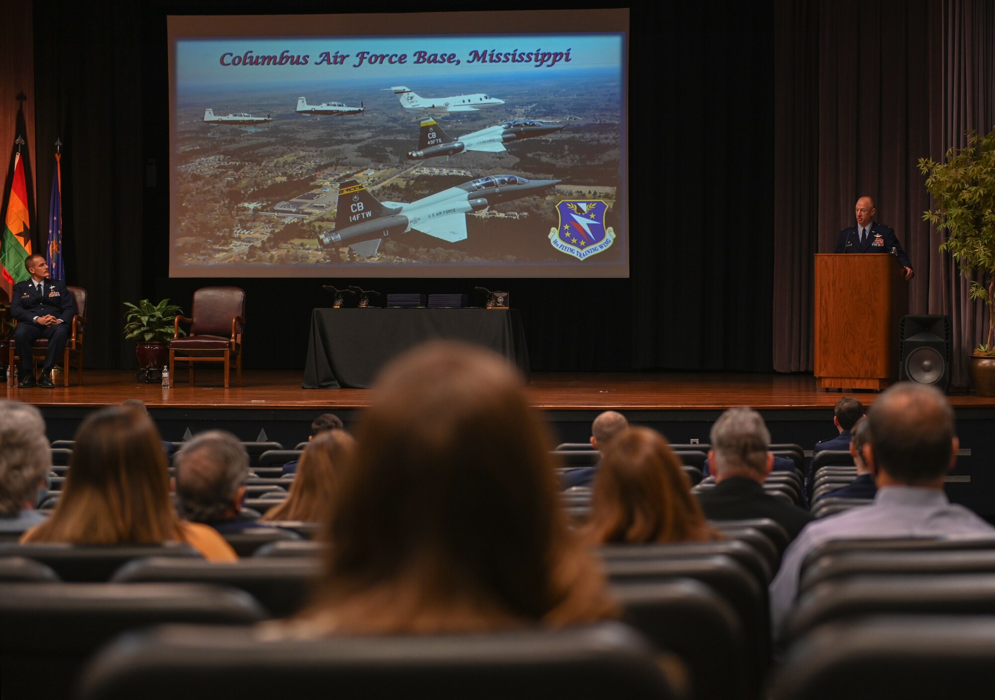 U.S. Air Force Col. Seth Graham, 14th Flying Training Wing commander, speaks to Specialized Undergraduate Pilot Training Class 21-03 and their families during a graduation ceremony on Dec. 11, 2020, at Columbus Air Force Base, Miss. Graham has conducted more than 2,600 flight hours, including 741 combat hours. (U.S. Air Force photo by Airman 1st Class Davis Donaldson)
