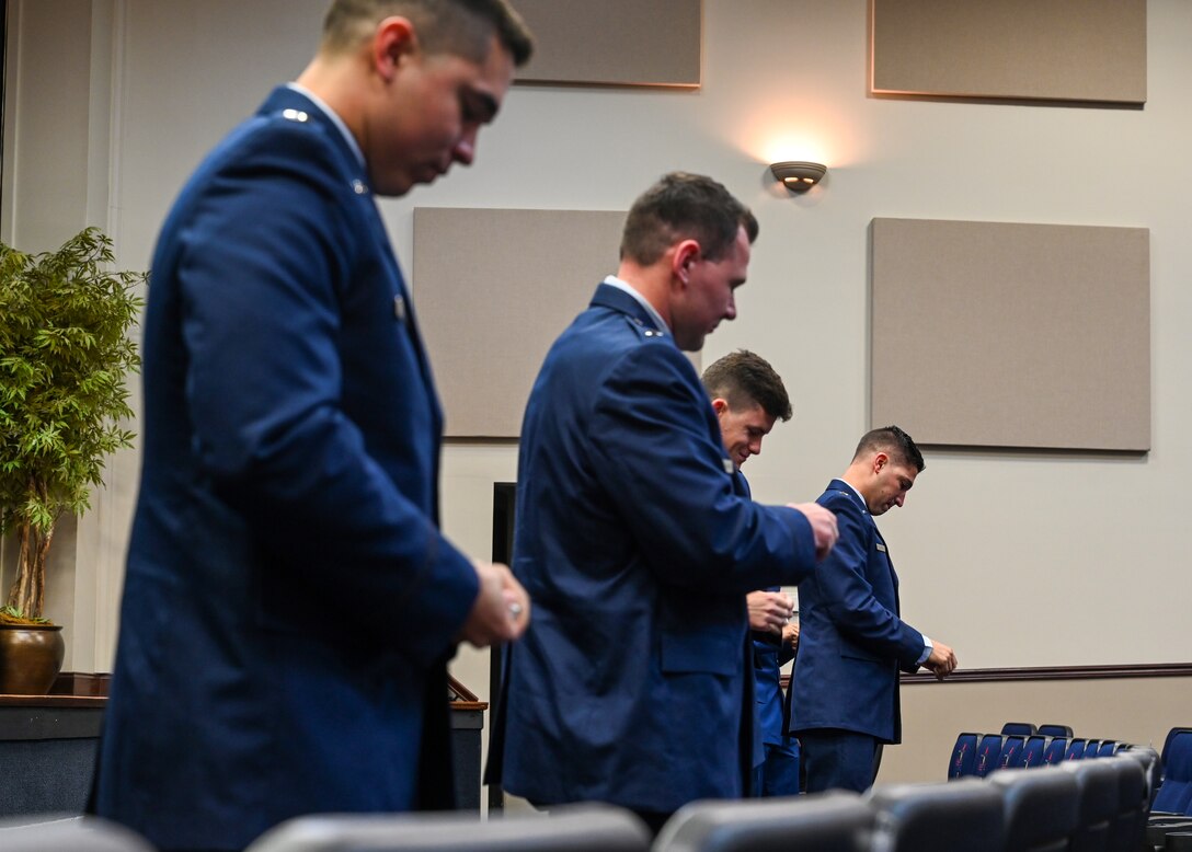 Members of Specialized Undergraduate Pilot Training Class 21-03 break their “silver wings” during their graduation ceremony on Dec. 11, 2020, at Columbus Air Force Base, Miss. As a result of COVID-19, the SUPT Class 21-03 had to split their graduation into two separate ceremonies. (U.S. Air Force photo by Airman 1st Class Jessica Williams)