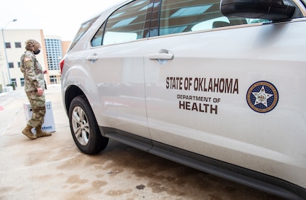 Oklahoma National Guardsmen prepare to load boxes of COVID-19 vaccinations into vehicles the Guard members will use to transport the vaccines to sites across the state, Dec. 15, 2020.

These are the first two boxes of vaccines to be distributed from one of five centralized hubs supporting 11 satellite locations across Oklahoma. The Guardsmen will be using Oklahoma State Department of Health vehicles to transport the vaccines to the satellite locations with an escort from the Oklahoma Highway Patrol. (Oklahoma National Guard photo by Anthony Jones)