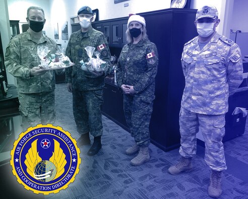 AFSAC Director Brig. Gen. Bruckbauer and USAF International Partners share holiday treats from different countries together in the AFSAC Directorate headquartered at WPAFB, Ohio.