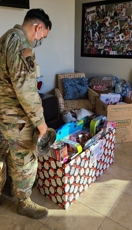 Tech. Sgt. Jordan Gonzales, 926th Wing volunteer, drops off toy donations to a local nonprofit, Dec. 14, in Las Vegas, Nev. (U.S. Air Force Photo by Staff Sgt. Paige Yenke)