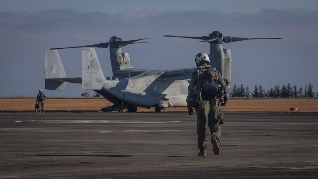 A U.S. Marine with Marine Medium Tiltrotor Squadron (VMM) 265, 1st Marine Aircraft Wing approaches an MV-22B Osprey at the flight line during exercise Forest Light Western Army at Camp Soumagahara, Gunma Prefecture, Japan, Dec. 5, 2020. Forest Light is an annual bilateral training exercise that strengthens the interoperability and readiness of the U.S. Marine Corps and Japan Ground Self-Defense Force to deter aggression and defeat any threat. This iteration is focused on seizing and defending key maritime terrain as an integrated force in support of naval operations in the defense of Japan. (U.S. Marine Corps photo by Sgt. Branden J. Bourque)