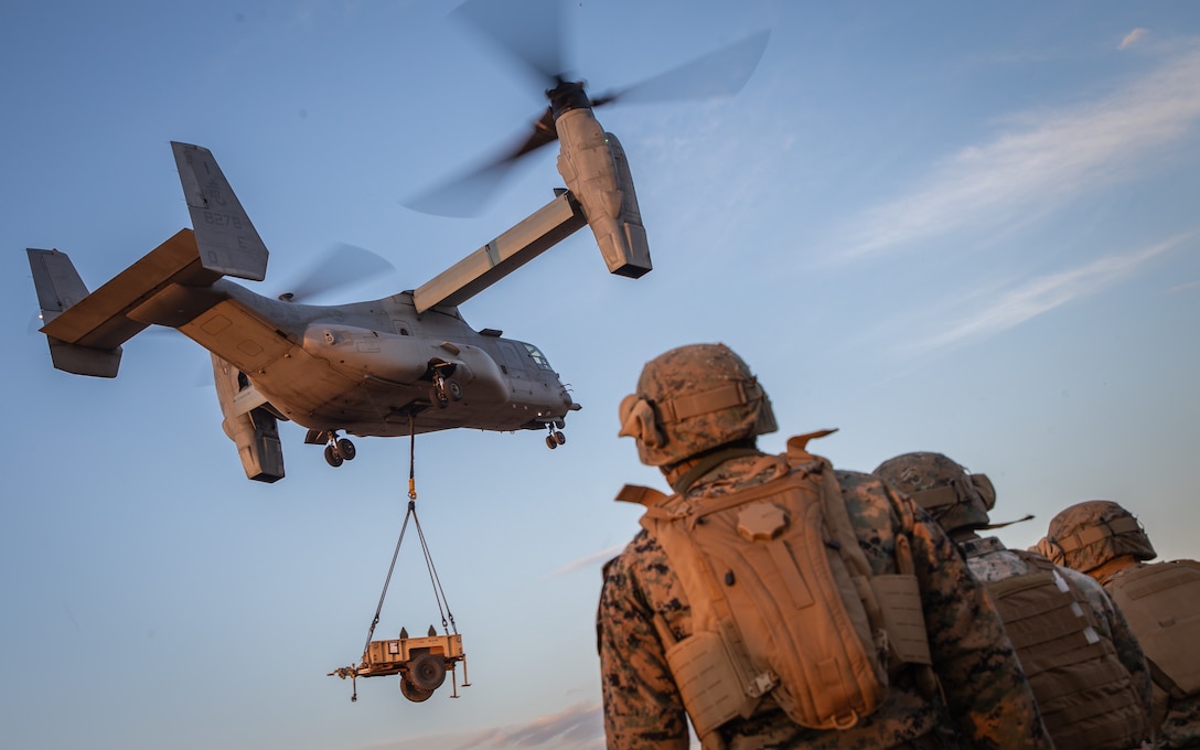 U.S. Marines with 3rd Battalion, 8th Marine Regiment observe as an MV-22B Osprey assigned to Marine Medium Tiltrotor Squadron (VMM) 265 conduct hoist operations during exercise Forest Light Western Army at Camp Soumagahara, Gunma Prefecture, Japan, Dec. 10, 2020. Forest Light is an annual bilateral training exercise that strengthens the interoperability and readiness of the U.S. Marine Corps and Japan Ground Self-Defense Force to deter aggression and defeat any threat. This iteration is focused on seizing and defending key maritime terrain as an integrated force in support of naval operations in the defense of Japan. 3/8 is forward-deployed in the Indo-Pacific as part of 3d Marine Division. (U.S. Marine Corps photo by Sgt. Branden J. Bourque)