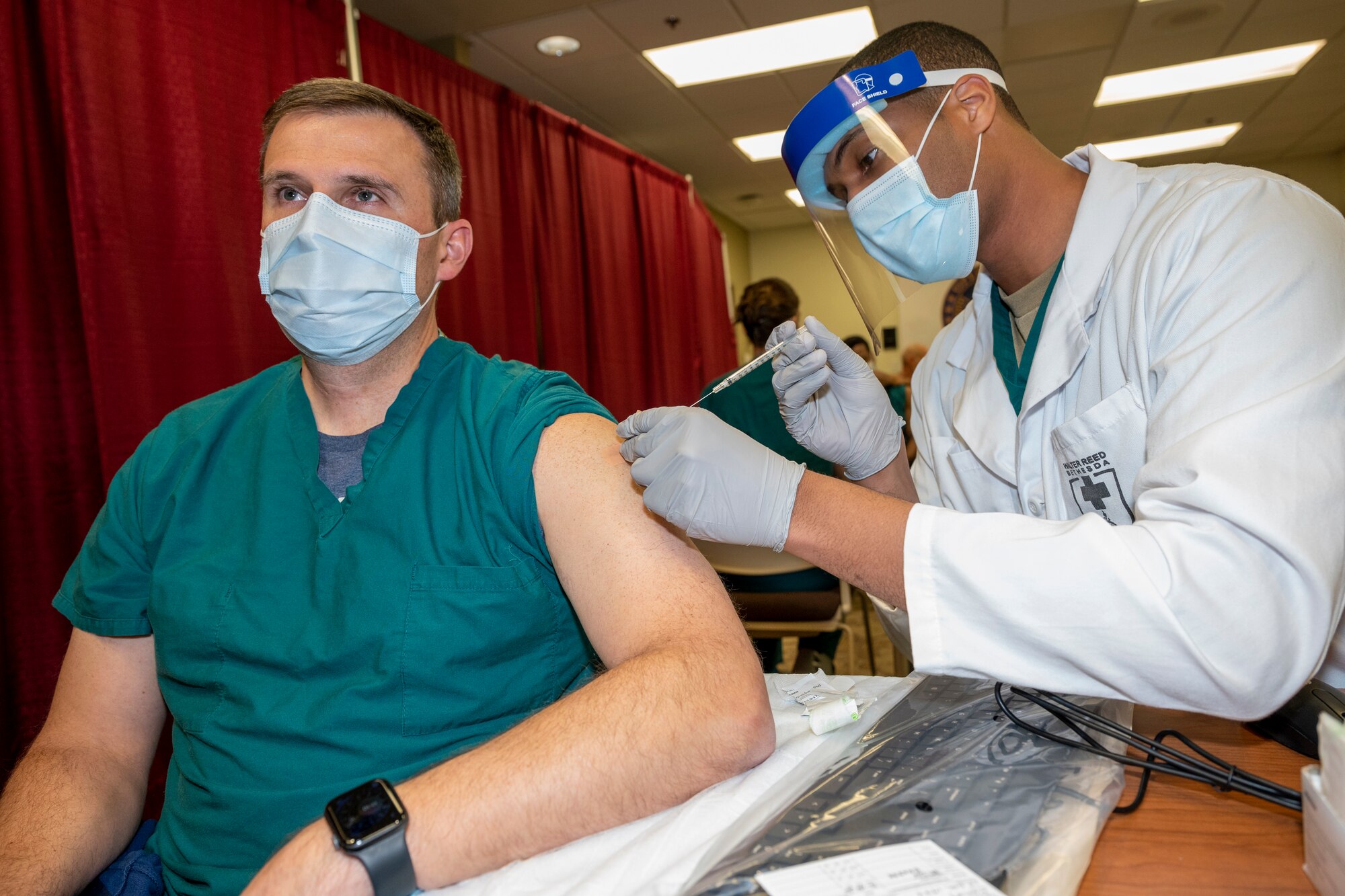 A doctor gets vaccinated.
