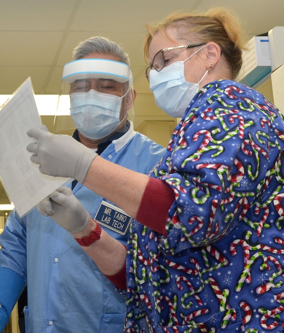 Staff at Naval Hospital Jacksonville prepare to unpack the first delivery of the Coronavirus (COVID-19) vaccination at on Dec. 15.