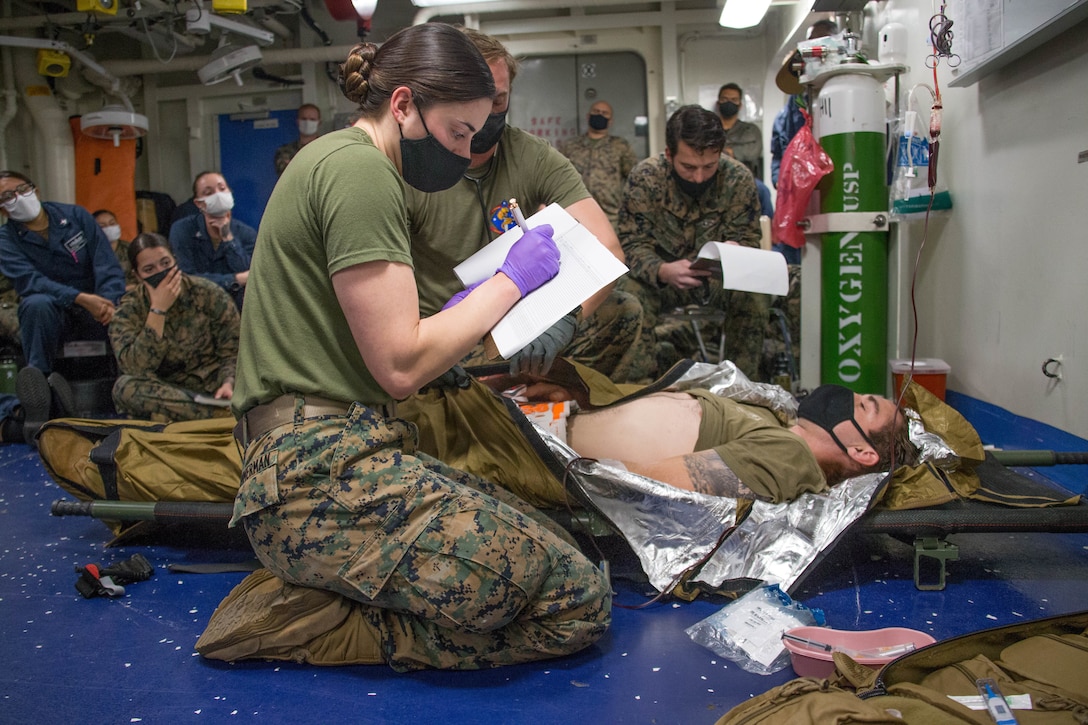 A Hospital Corpsman documents a patient's vitals during Valkyrie emergency fresh whole blood transfusion training aboard the amphibious assault ship USS Makin Island (LHD 8), Nov. 14.