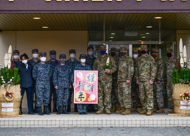 Japanese Airmen and U.S. Air Force Airmen pose for a picture.