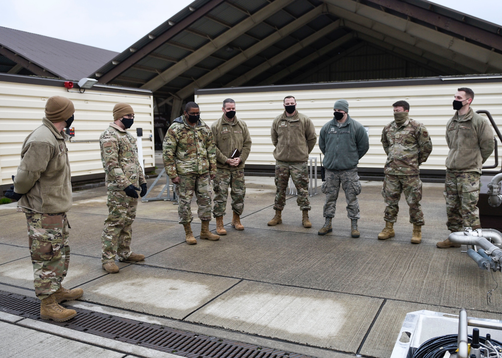U.S. Air Force Maj. Gen. Randall Reed, Third Air Force commander, and Chief Master Sgt. Randy Kwiatkowski, Third Air Force command chief, meet with the 52nd LRS Airmen during their visit, Dec. 7, 2020, at Spangdahlem Air Base, Germany. The 52nd LRS Airmen showcased their readiness, displayed their vehicles and discussed their innovation plans and projects. (U.S. Air Force photo by Senior Airman Melody W. Howley)