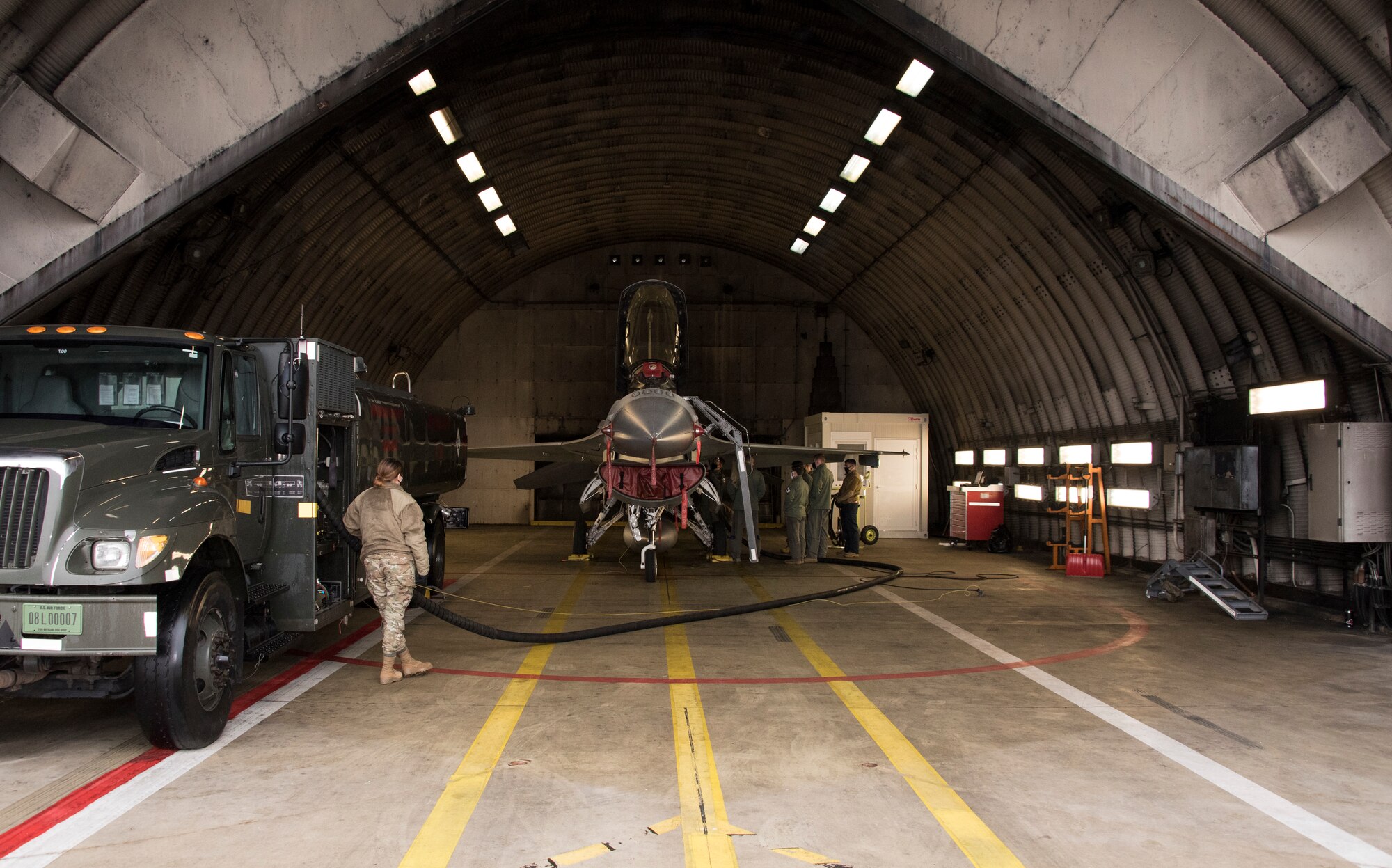 Airmen from the 52nd Maintenance Group train a group of pilots on how to refuel F-16 aircraft at Spangdahlem Air Base, Germany, Dec. 11, 2020. The training increases Agile Combat Employment capabilities and creates more multicapable Airmen within the 52nd Fighter Wing. (U.S. Air Force photo by Senior Airman Chance D. Nardone)