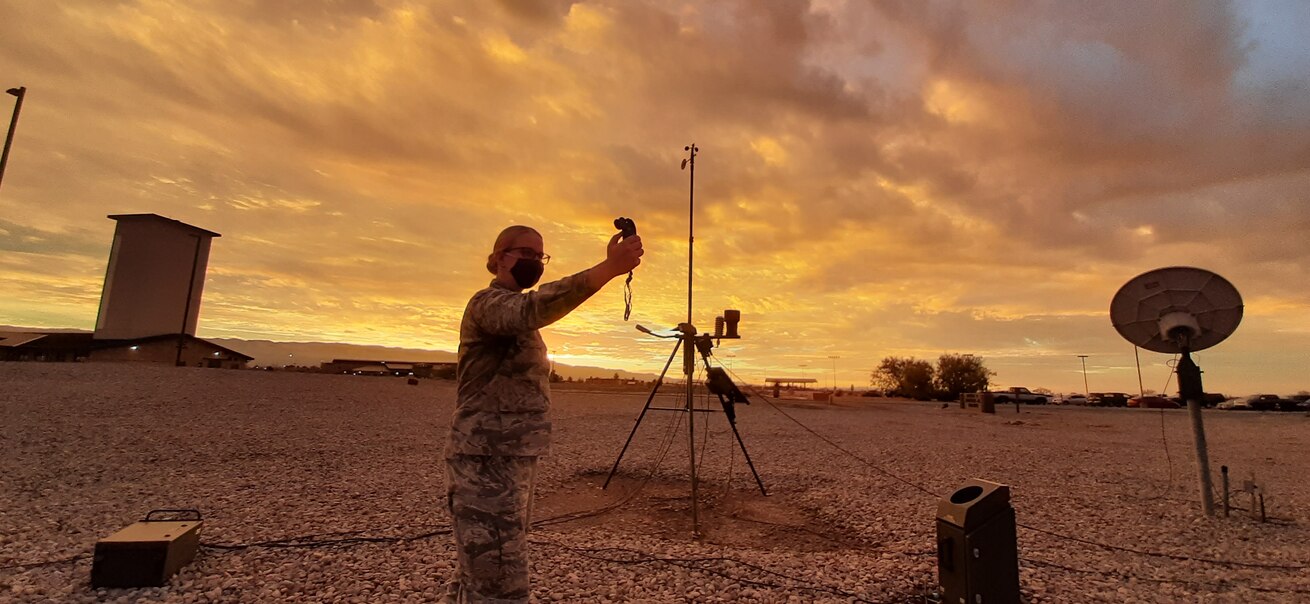 Airman 1st Class Katherine Strobach, 54th Operations Support Squadron Weather Flight weather technician, takes a weather measurement using manual observing techniques, Dec. 11, 2020, on Holloman Air Force Base, New Mexico. Weather Airmen must continue to hone manual skills in the event computer or network connections are lost. (Courtesy photo)