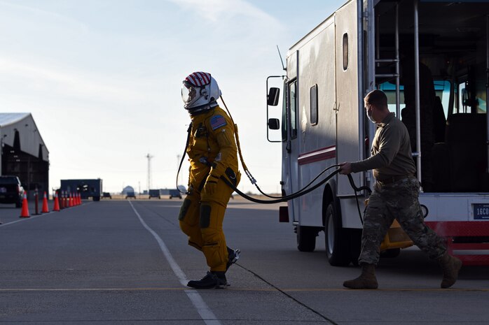 A U-2 pilot approaches a hangar to take flight in the first-ever military flight with artificial intelligence.