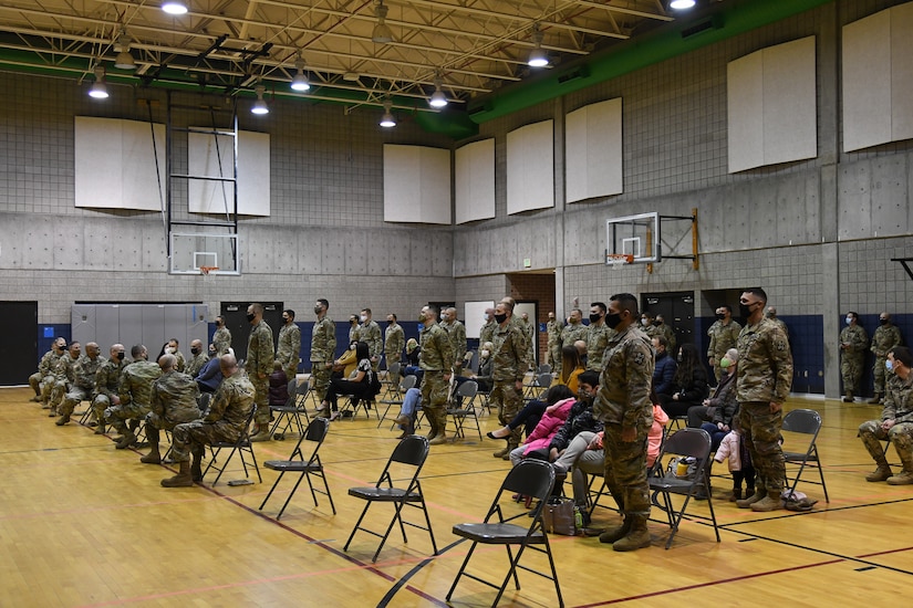 Deploying Soldiers stand during a farewell ceremony