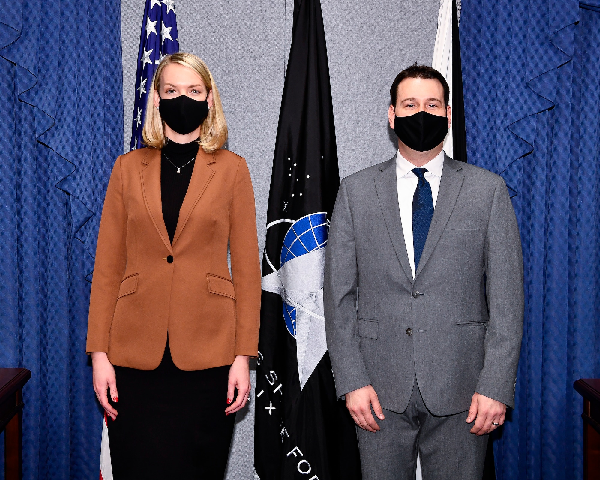 Alison Wargo, left, an illustrator with the Institute of Heraldry, and division chief Andrew Wilson pose before a ceremony at the Pentagon unveiling the U.S. Space Force Space Staff Badge, Arlington, Va., Dec. 11, 2020. Service members assigned to Space Force at the Pentagon will wear the badge.