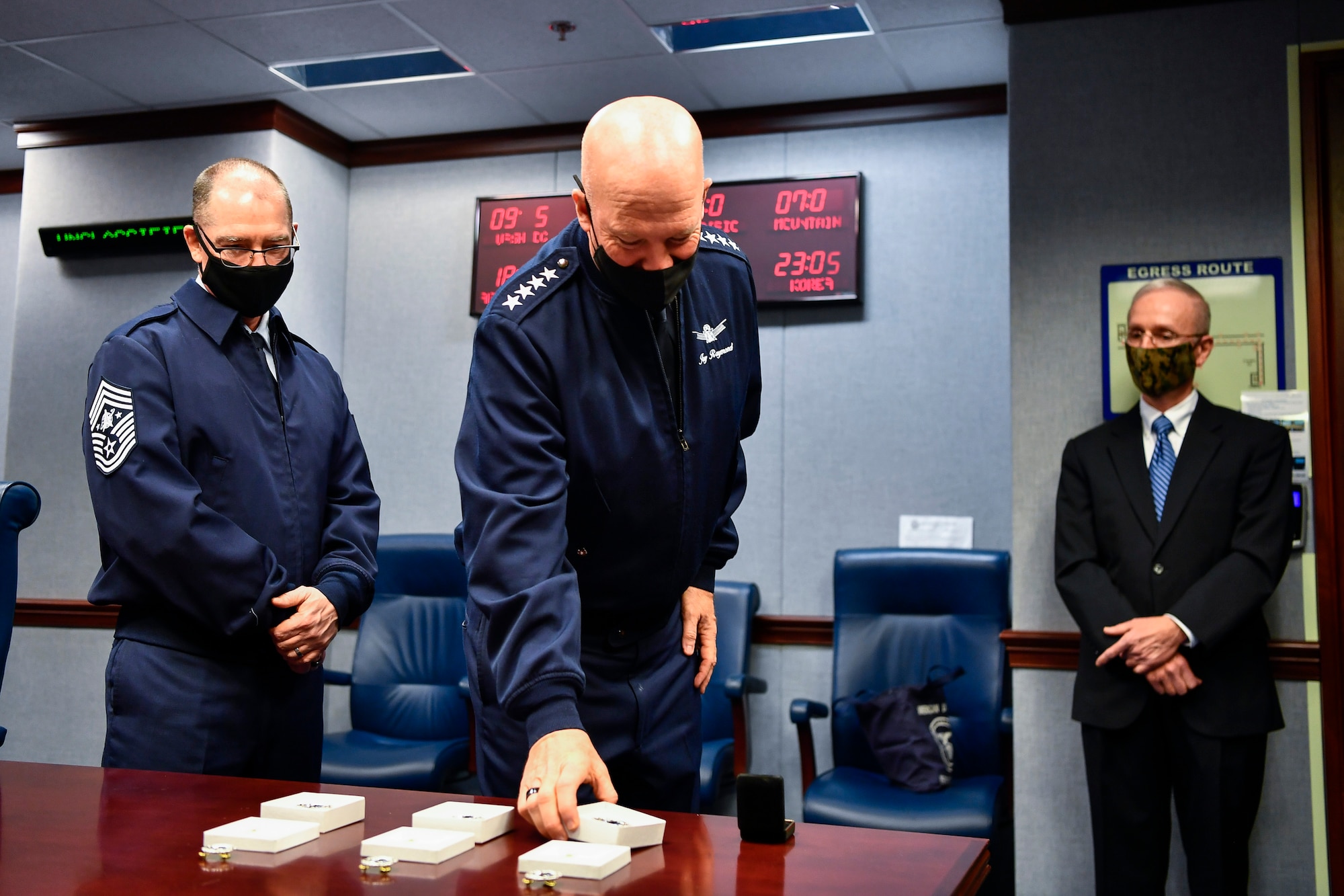 Chief of Space Operations Gen. John W. Raymond examines U.S. Space Force Space Staff Badges before an unveiling ceremony at the Pentagon, Arlington, Va., Dec. 11, 2020. Service members assigned to Space Force at the Pentagon will wear the badge
