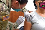 An Army family member at Fort Bliss, Texas receives the seasonal flu vaccine at a community flu drive held Oct. 9, 2020, at the Fort Bliss Main Exchange. More than 600 Army family members and military retirees were vaccinated during the two-day event.