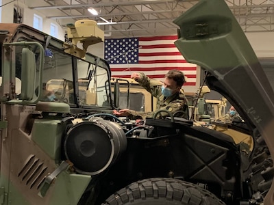 A Virginia National Guard Soldier assigned to the Staunton-based 116th Infantry Brigade Combat Team conducts pre-mission maintenance checks Dec. 16, 2020, in Staunton, Virginia.