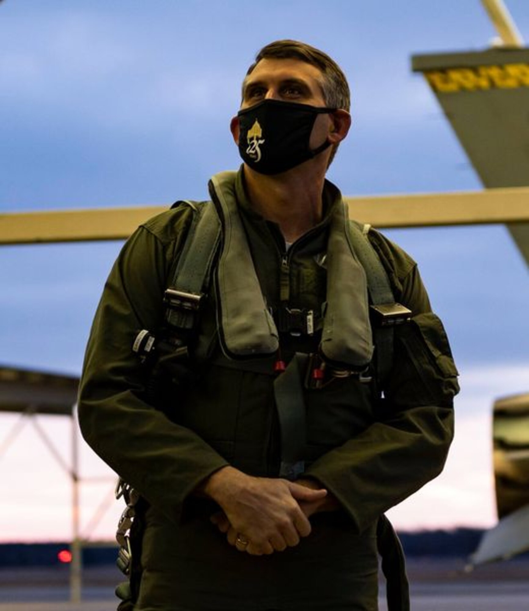 A photo of a man in a flight suit.