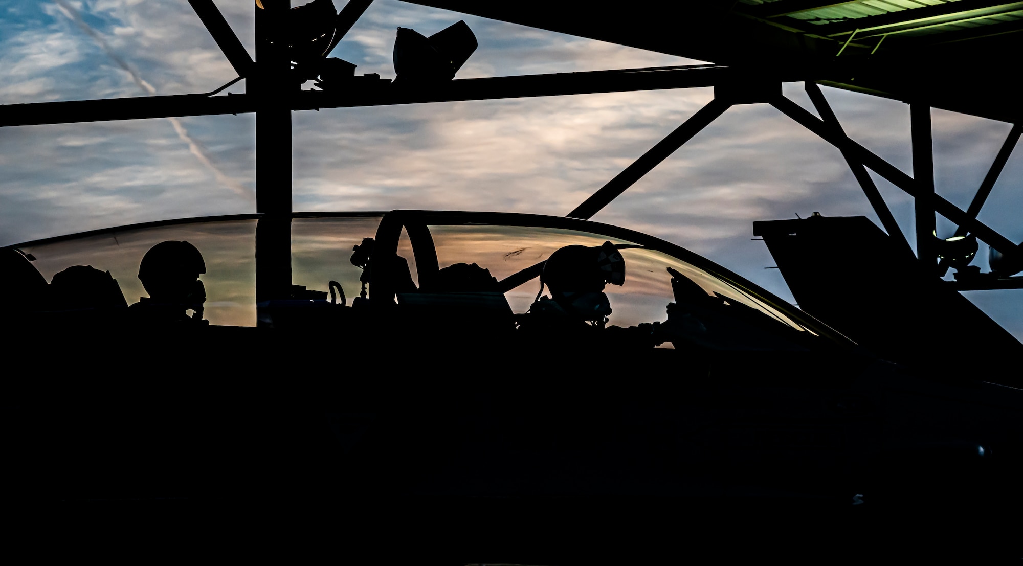 A photo of Airmen in a jet.